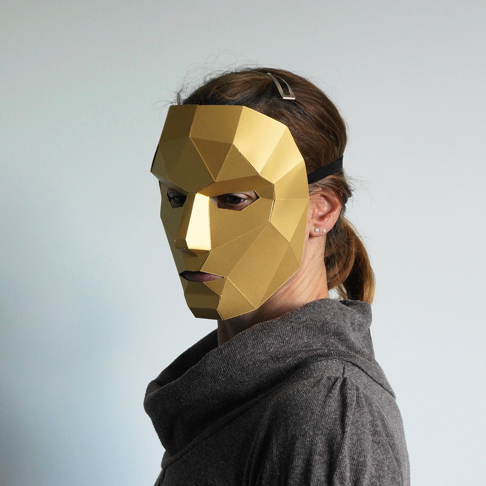 women in gold card mask